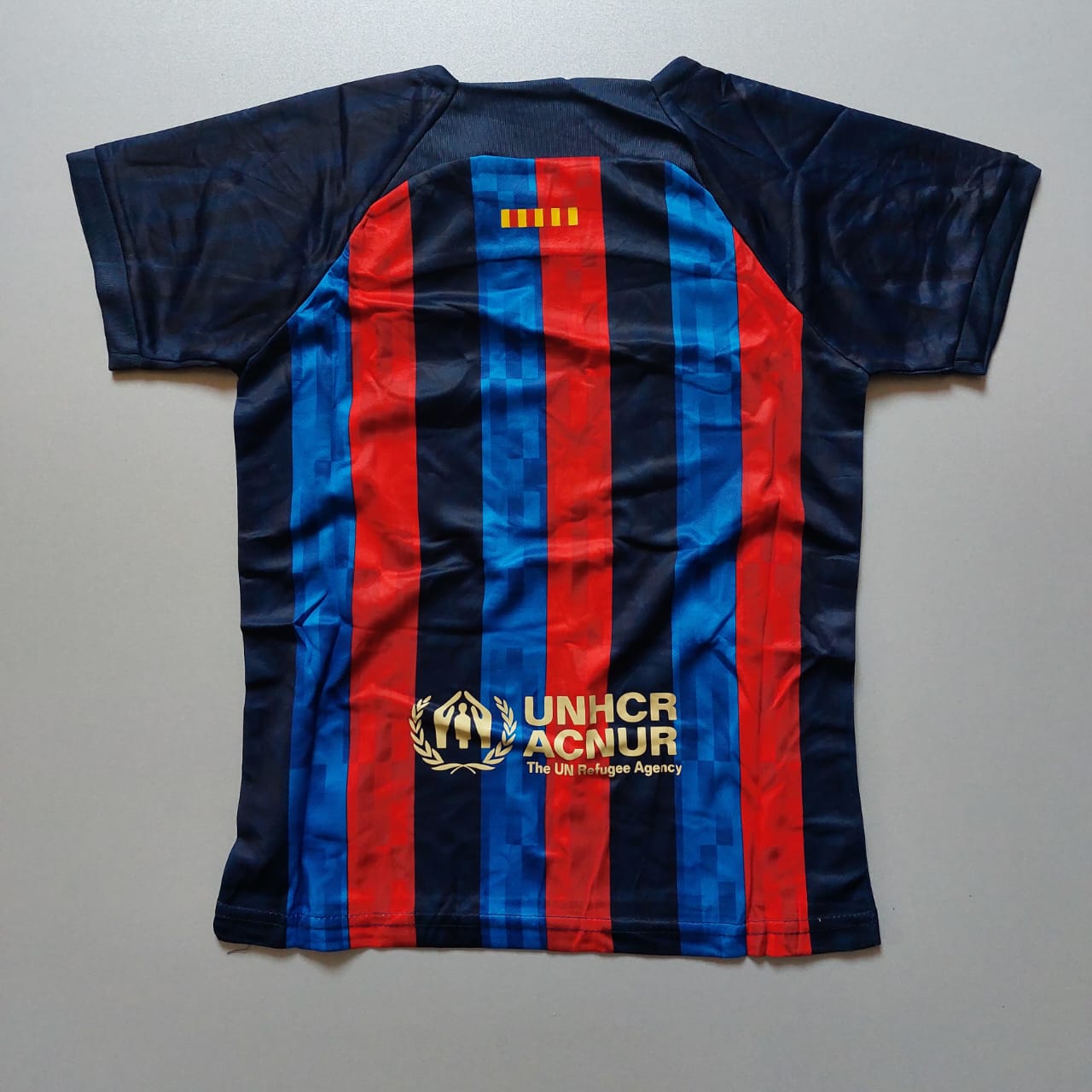 لباس اول بارسلونا - بچگانه (کیفیت A - فصل 22/23) به همراه شورت ورزشی